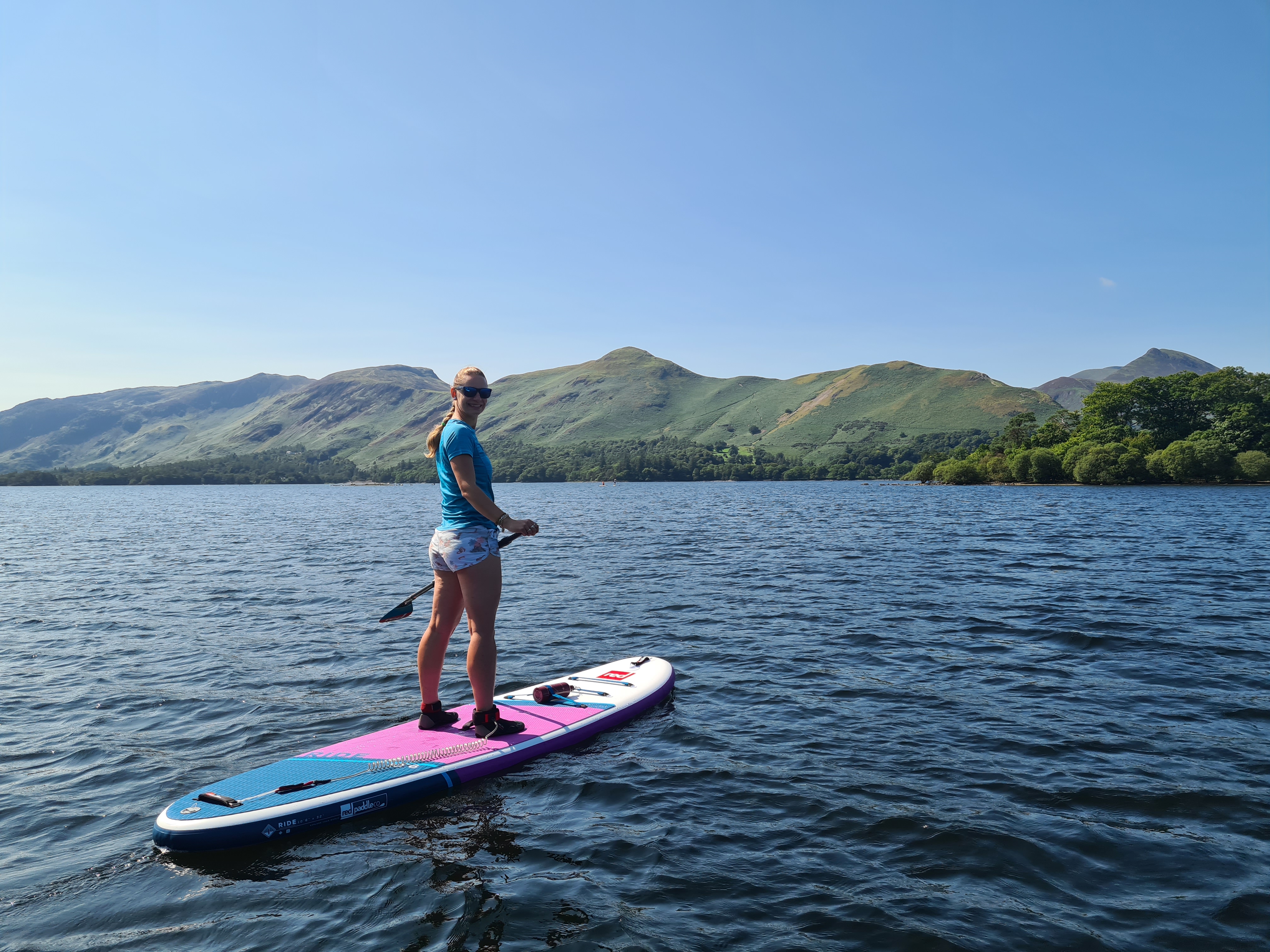 Shona paddleboarding in the Lake District — co-founder of BookWild